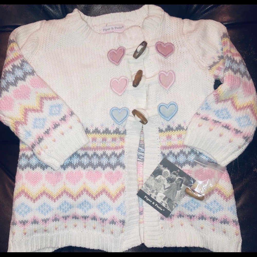 NEW Baby Cardigan with tags and extra toggle.